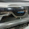 Фара головного света левая б/у для BMW 7 серия - 2